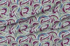 an image of a fabric with purple and green swirls on the front, as well as