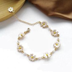 Size: 16-22 cm adjustable Material: alloy steel brass zinc Weight for 2: 0.2 oz Flowers Bracelets, Homeward Bound, Daisy Charm, Daisy Bracelet, Minimalist Flowers, Pretty Jewelry, Dainty Bracelets, Cute Bracelets, Hand Jewelry