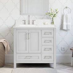 a white bathroom vanity with a mirror above it