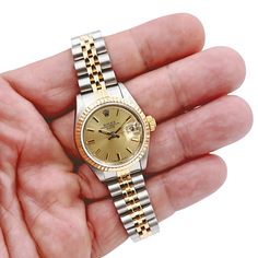 Ladies Rolex 26mm Date 18K Yellow Gold Two Tone Watch with Champagne Dial and Fluted Bezel. Pre-Owned SN# 877**** Brand: Rolex. Model: DateJust. Crystal: Sapphire. Gender: Women's. Condition: EXCELLENT. Dial Color: Champagne. Model Number: 69173. Case Dimensions: 26mm. Hour Mark: Non-Numeral. Movement: Self-Winding (Automatic). Metal Type: 18K Yellow Gold / Stainless Steel. Bracelet / Strap: Jubilee 18K Gold / Stainless Steel. Box / Certification: Rolex Box / Certificate of Authenticity. Warrant Rolex Watches Women 26mm, 26mm Rolex Women, Two Tone Rolex Women, Rolex 26mm, Rolex Datejust Women, Visualization Board, Rolex Lady Datejust, Rolex Watches Women, Rolex Women