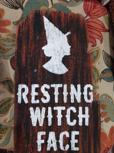 a wooden sign that says resting witch face