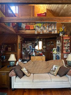 a living room filled with furniture and lots of clutter