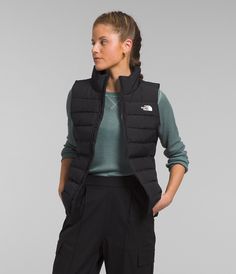 We’ve updated the fan-favorite Women’s Aconcagua line to include 100% recycled body fabric on the outside, and a combination of fully recycled 600-fill down and synthetic insulation on the inside. The Women’s Aconcagua 3 Vest provides the core warmth you need, with unrestricted mobility. Women's Women's Vests [North Face, Northface, thenorthface, the northface, TNF, tnf] North Face Vest, Outerwear Vest, Black Vest, Black North Face, Down Vest, Polyester Top, Sleeveless Vest, North Face Women, Womens Vest