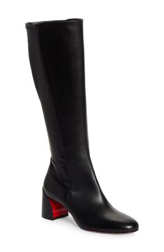 A sculptural block heel brings a contemporary aesthetic to this minimalist boot crafted from calfskin leather and grounded by that iconic Louboutin-red sole. 2" heel, 50mm (size 36.5) 14" shaft, 12 1/2" circumference (size 36.5) Inset side-zip closure Wipe with a soft, dry cloth and store in a dust bag Please note the red lacquer on soles will wear off as a result of normal use. To minimize the effect, avoid wearing in wet weather or on abrasive surfaces Leather upper, lining and sole Made in It Black Louboutin Boots, 2000’s Boots, Red Bottom Boots, Minimalist Boots, Luxury Pieces, Louboutin Boots, Christian Louboutin Boots, Finance Career, Luxury Boots