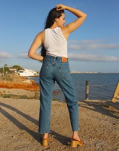 550 Levi's jeans in blue. High rise. Zipper fly. Front and back pockets. Straight leg. Available sizes: 29" waist EU 38-40 / UK 10-12 Actual measurements - 29"(74cm) waist - 38"(97cm) hips - 29"(74cm) inner leg - 10.5"(27cm). 30" waist EU 40 / UK 12 Actual measurements - 30"(76cm) waist - 38"(97cm) hips - 29.5"(75cm) inner leg - 11"(28cm). 31" waist EU 40-42 / UK 12-14 Actual measurements - 31"(79cm) waist - 38"(97cm) hips - 30"(76cm) inner leg - 11"(28cm). 32" waist EU 42 / UK 14 Actual measure Best Levis Jeans For Women, 550 Levis Jeans, Vintage Mom Jeans, Vintage Mom, Jumpsuit Skirt, Sleeveless Jacket, Lee Jeans, Isle Of Man, Jeans Womens