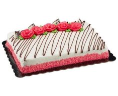 a decorated cake with pink roses on top