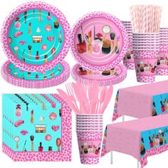 pink and blue party supplies including plates, cups, napkins and tablecloths