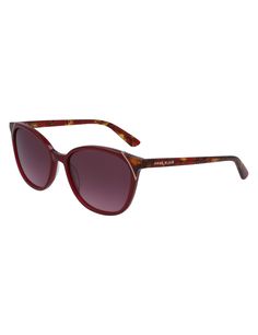 This rounded cat-eye shape features a warm crystal merlot frame front with rose gold metal and red tortoise top corner detailing. Red tortoise color extends throughout temples. Burgundy gradient lenses. Hard case included. Measurements: 55-17-135 Tortoise Color, Modern Cat, Rose Gold Metal, Merlot, Eye Shapes, Sunglasses Vintage, Cat Eye, Tortoise, Cat Eye Sunglasses