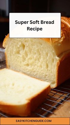 a loaf of bread sitting on top of a metal rack next to a slice of bread