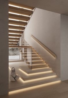 the stairs are lit up with leds to illuminate light in this modern home