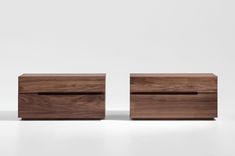 two wooden drawers sitting next to each other