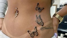 a woman's stomach with butterflies on it