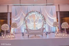 an elegant wedding setup with white flowers and candles