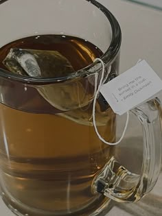 a glass mug filled with liquid and ice