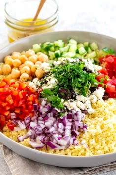 a white bowl filled with different types of vegetables