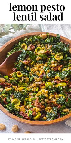 lemon pesto lentil salad in a wooden bowl on a table with almonds