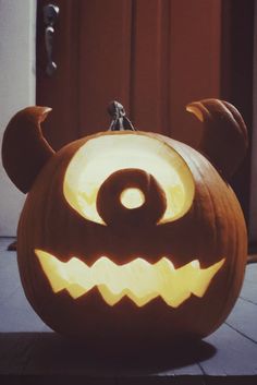 a carved pumpkin with an evil face on it