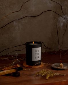 Like a crackling fire in a cozy cabin, smoky notes of woodsmoke, incense, and cedar embers meld together to form a blanket of aroma, enveloping you in its warmth. Dark Candle Aesthetic, Candle Photoshoot, Candle Board, Monochrome Aesthetic, Brooklyn Candle Studio, Candles Dark, Candles Photography, Candle Studio, Candle Glow