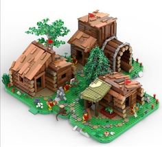 a lego model of a house with trees and bushes on the front, and two small houses in the back