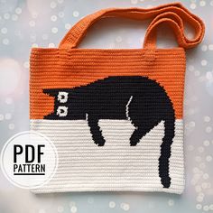 an orange and white bag with a black cat on the front is featured in this image