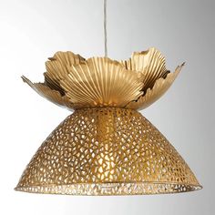 a gold colored lamp hanging from a ceiling