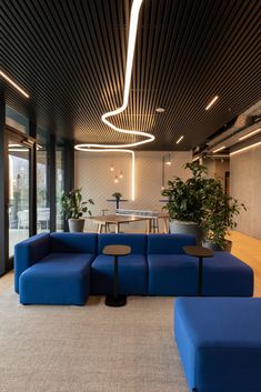 a large blue couch sitting in the middle of a room