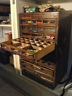 an old wooden cabinet with many drawers