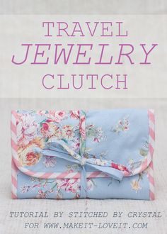 the cover of travel jewelry clutch is shown with flowers on blue fabric and pink stripes