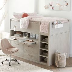 a loft bed with desk and drawers underneath it