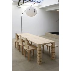 a table and benches in an empty room