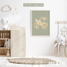 a baby's room with white walls and wooden furniture