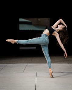 a woman is doing a dance move on the floor