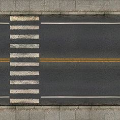 an overhead view of a street with two yellow lines on the road and one white line at the top