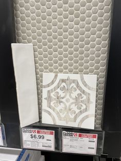 some white and black items are on display in the store for $ 5 99 per square foot