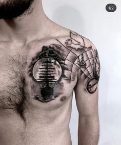 a man's chest with an abstract tattoo design on it, and a globe in the middle