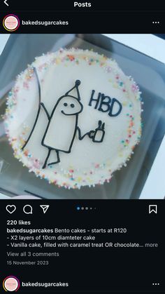 a cake that has been decorated with the words hbd on it and is in a plastic container