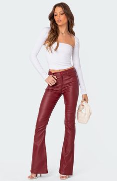 These flared faux-leather pants give you a fierce edge and a boost of confidence when you need it most. Zip fly with button closure Five-pocket style 45% polyester, 45% rayon, 10% spandex Hand wash, dry flat Imported Leather Flare Pants, Red Leather Pants, Shrug Top, Bell Bottom Trousers, Burgundy Jeans, Maroon Leather, Bootcut Pants, Faux Leather Pants, Flared Jeans