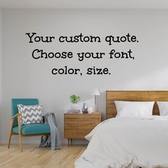 a bedroom with a bed, chair and wall decal that says your custom quote choose your font, color, size