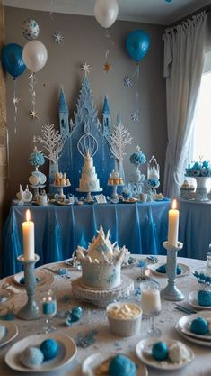 a table topped with cake and cupcakes covered in frosting