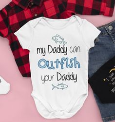 Newborn Infant Fishing Shirt Bodysuit - My Daddy Can Outfish Your Daddy - Funny Humor Baby Shower Pregnancy Announcement for Dad  Outdoors  All of our baby bodysuits are printed on the highest quality garment. All are made in the US & shipped from the Midwest.    All orders are shipping between 1-3 days, unless we are waiting to hear back from our customer.   DONT SEE YOUR SPORTS TEAM?  Message me with your favorite team and I'll send you a link we more then likely already have the files for the Dad Humor, Baby Outfits Newborn, Fishing Shirts, Gender Neutral Baby, Pregnancy Announcement, Baby Bodysuit, Newborn Baby, Baby Toddler