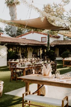 an outdoor dining area with tables and chairs