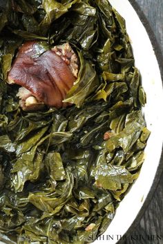 collard greens with bacon in a white bowl