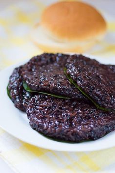 two hamburger patties on a white plate