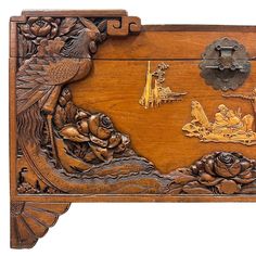 an ornate wooden box with carvings on it