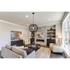 a living room filled with furniture and a fire place