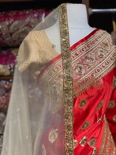 Bright Red Banarasi Silk Saree with an ensemble of fine work beads, pearls and sequins highlight intensifies the look of the Saree. Cut dana and zari work makes it a must way outfit for every bride to be. The saree has an unstitched blouse and a contrasting net dupatta is another great way to add it to your bridal wear. Fabric: Pure Silk Custom designed according to client measurements and color preference. Production and delivery time is 120 days! Festive Red Traditional Designer Wear, Designer Red Dupatta, Red Traditional Wear For Designer Diwali, Red Kundan Anarkali Set With Gota Work, Red Art Silk Anarkali Set With Gota Work, Elegant Red Sharara With Dori Work, Transitional Season Red Raw Silk Sets, Transitional Red Raw Silk Sets, Elegant Red Anarkali Set With Dori Work