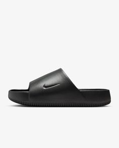 This is a NEW, never-worn, pair of Nike CALM SLIDE sandals in the "BLACK" or "Noir" colorway in Men's Size 6. These are Nike model FD4116-001 and they are amazing! Here is additional information on this incredible footwear: When it comes to these slides, it's all in the name. Take a deep breath and slip into a minimalist look with maximalist cushioning. Contoured foam is seamlessly created from one piece, and cradles your feet to help keep them in place. To top it off, the water-friendly design Black Modern Slip-on Slides, Modern Black Slides With Textured Footbed, Black Slip-resistant Sandals With Round Toe, Modern Slide Sandals For Streetwear, Modern Black Slip-on Flip Flops, Nike Slides With Rubber Sole, Modern Black Slippers With Rubber Sole, Black Modern Slippers With Rubber Sole, Slip-resistant Sandals For Streetwear