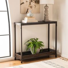 a potted plant sitting on top of a metal shelf