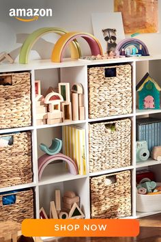 a white bookcase filled with lots of toy bins and baskets on top of it