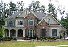 a large brick house with lots of windows